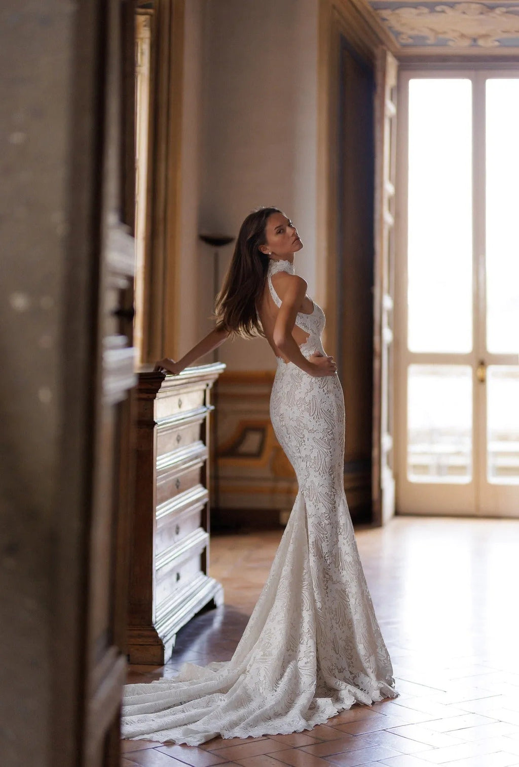 Sleeveless turtleneck top with mermaid tail skirt made of guipure-lace featuring floral ornament all over the dress.
